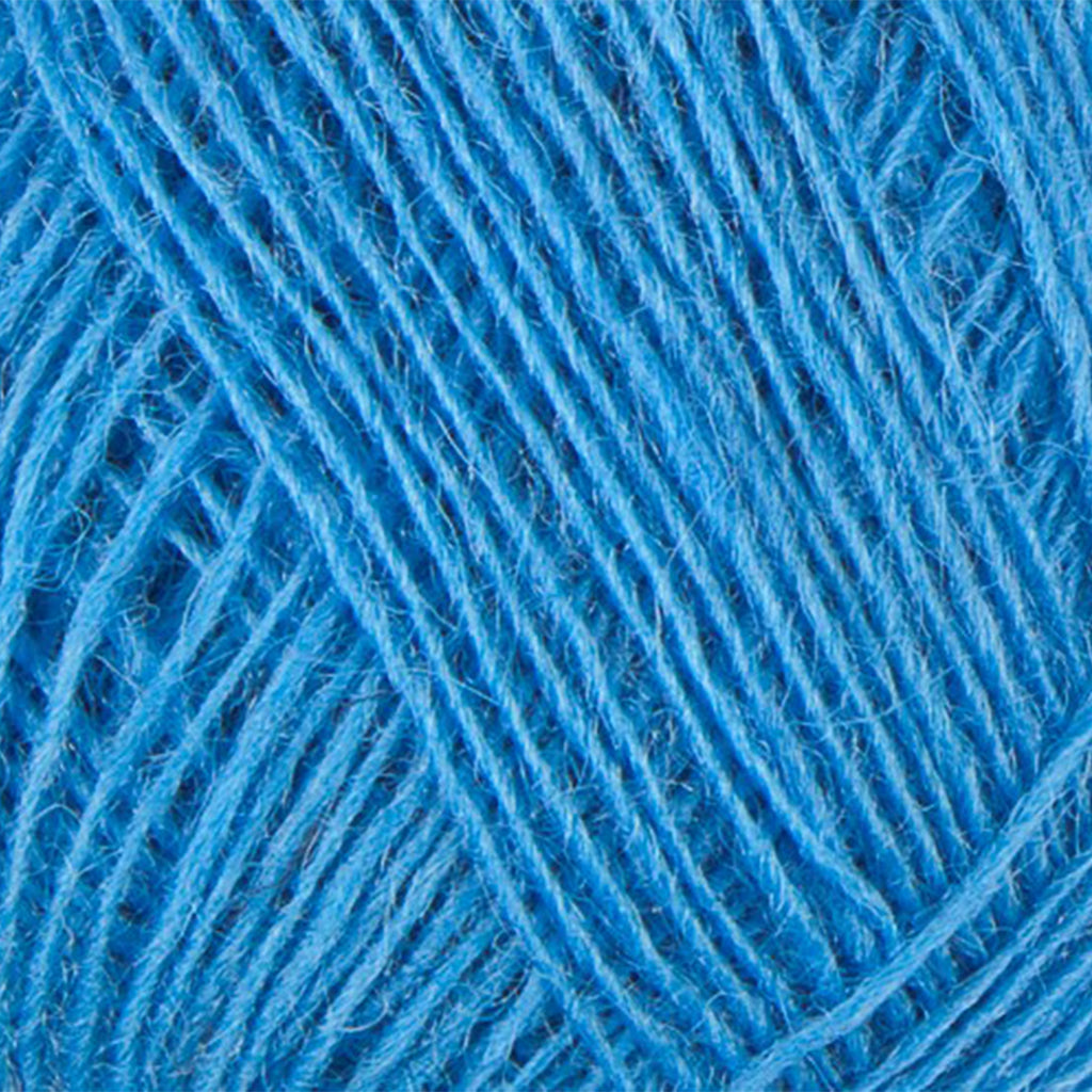 Sky Blue 9281, a vibrant light blue skein of Lopi's Einband Icelandic wool lace yarn.