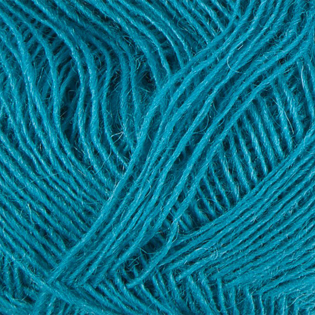 Turquoise 1762, a bright turquoise blue skein of Lopi's Einband Icelandic wool lace yarn.