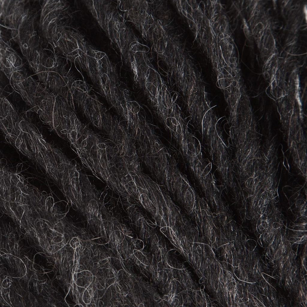 A hank of Lopi's Super Bulky wool yarn Jöklalopi in the color Black Heather 0005.