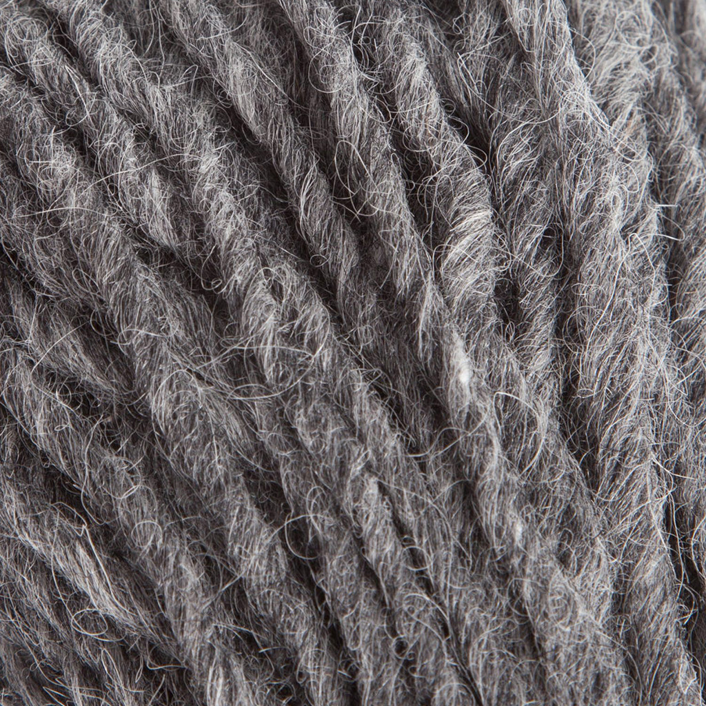 A hank of Lopi's Super Bulky wool yarn Jöklalopi in the color Dark Grey 0058.