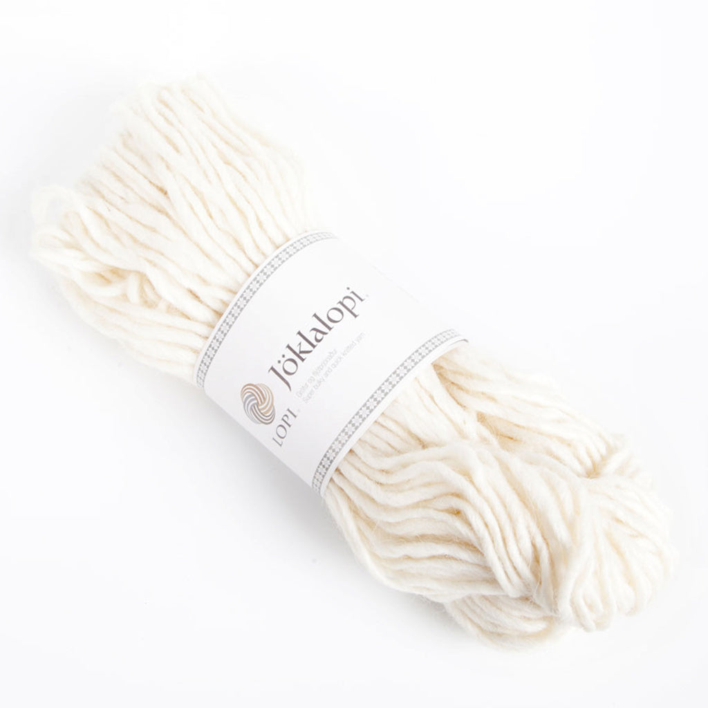 A hank of Lopi's Super Bulky wool yarn Jöklalopi in the color White 0051.