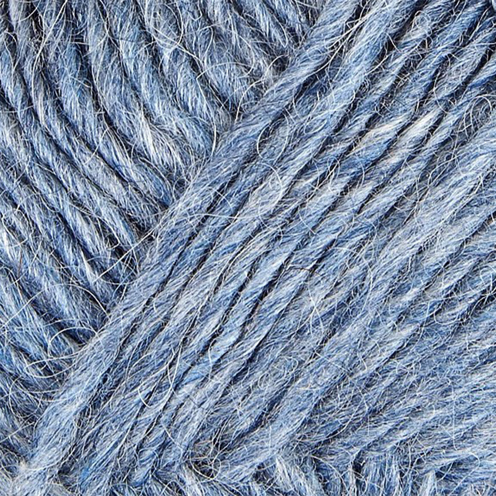 Air Blue 1700, a heathered dark blue and birght white skein of Léttlopi Icelandic wool yarn.