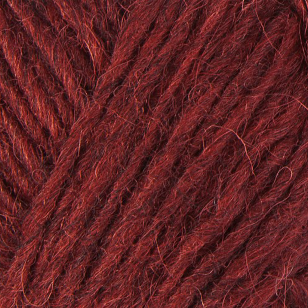 Brick 9431, a dark heathered red skein of Léttlopi Icelandic wool yarn.