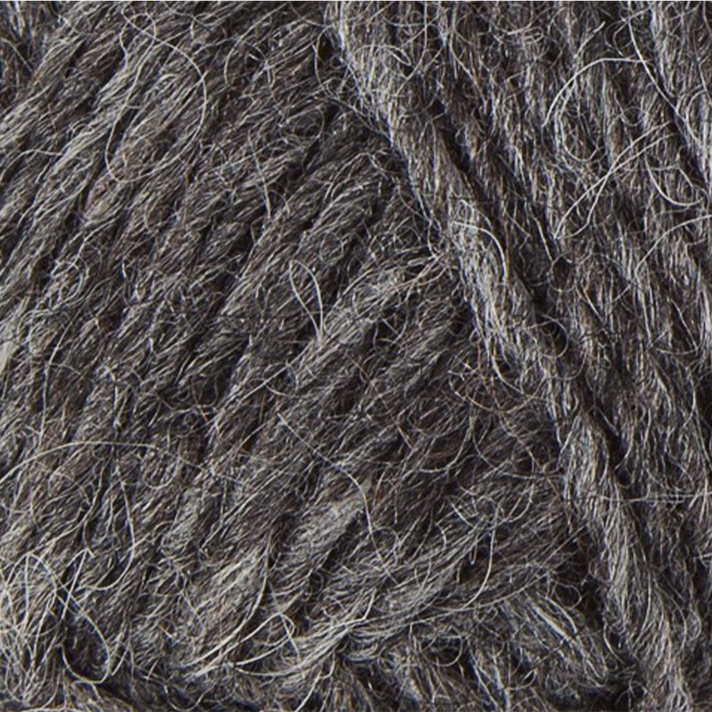 Dark Grey 0058, a dark heathered grey skein of Léttlopi Icelandic wool yarn.