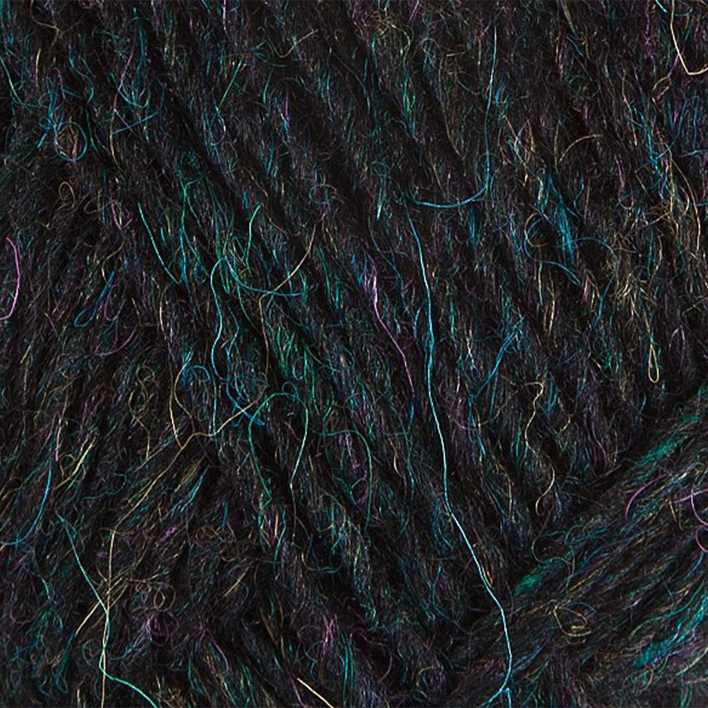 Galaxy 1707, a heathered black with flecks of color skein of Léttlopi Icelandic wool yarn.