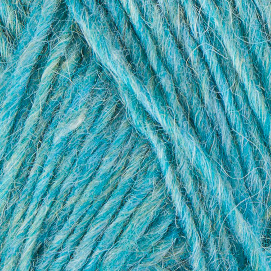 Glacier Blue 1404, a heathered bright bright blue and white skein of Léttlopi Icelandic wool yarn.