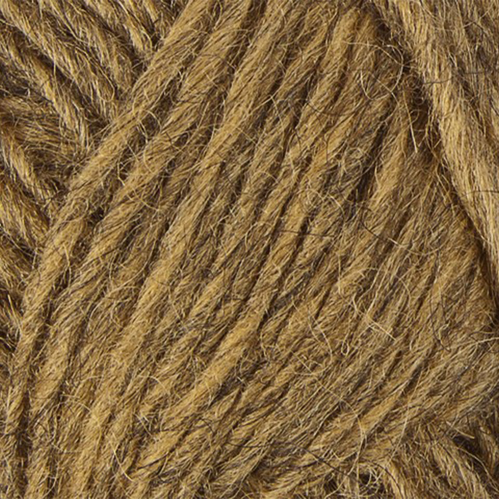 Golden 9426, a heathered light yellow skein of Léttlopi Icelandic wool yarn.