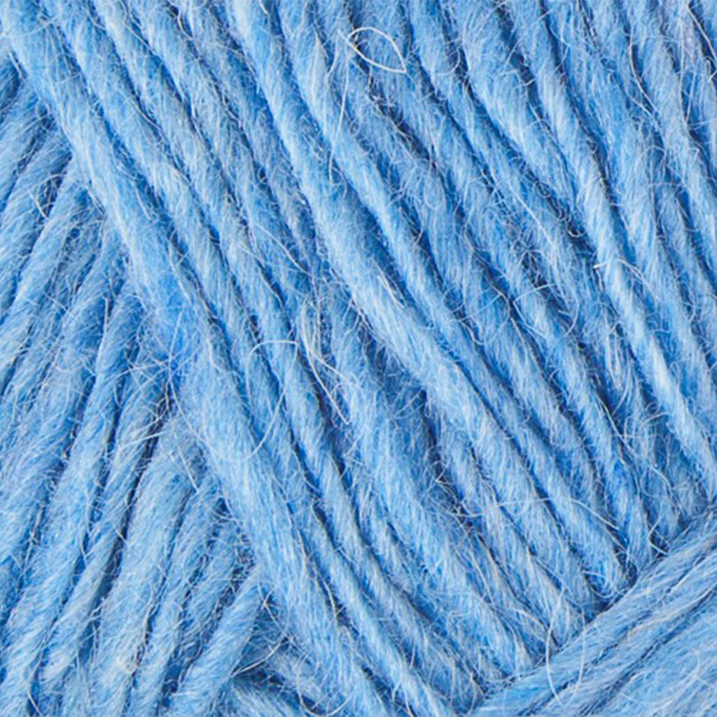 Heaven Blue 1402, a bright light blue skein of Léttlopi Icelandic wool yarn.