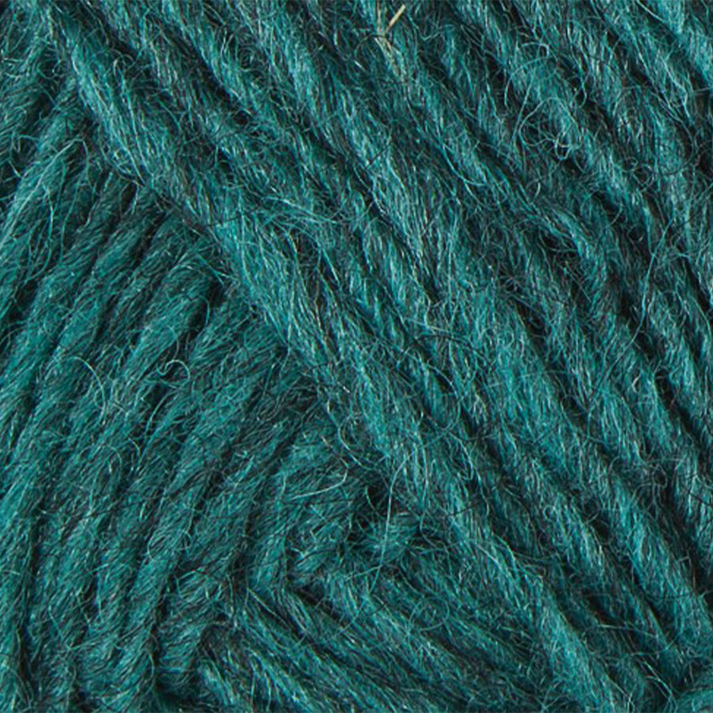 Lagoon 9423, a heathered rich, dark teal blue skein of Léttlopi Icelandic wool yarn.