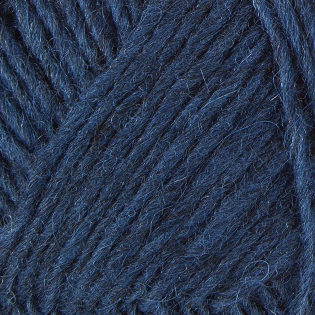 Ocean Blue 9419, a dark blue skein of Léttlopi Icelandic wool yarn.