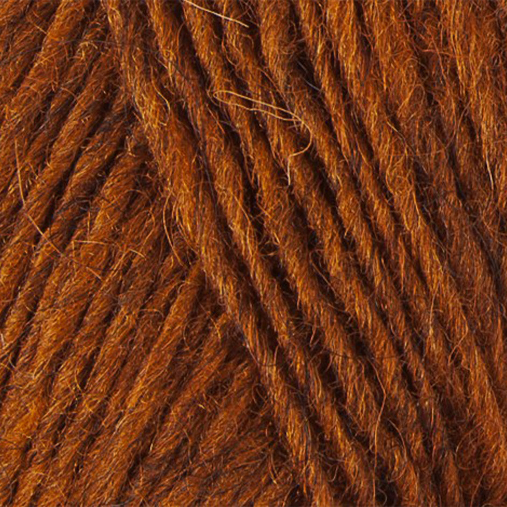 Rust 9427, a heathered golden orange skein of Léttlopi Icelandic wool yarn.