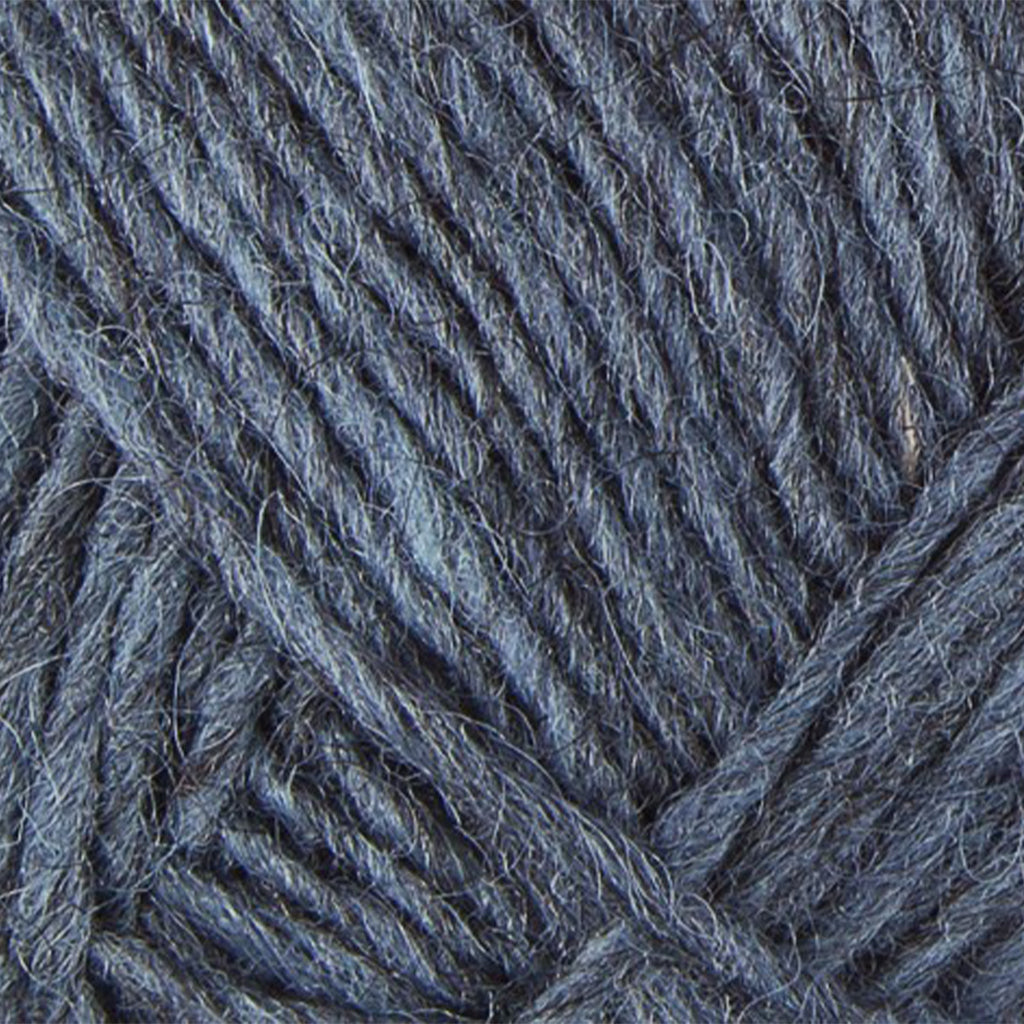Stone Blue 9418, a heathered denim blue skein of Léttlopi Icelandic wool yarn.