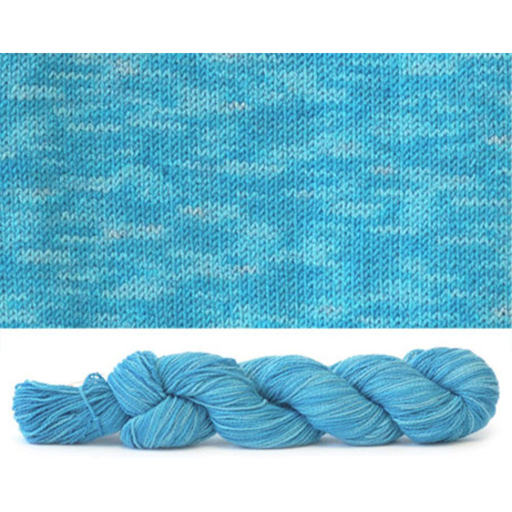 CoBaSi fingering in the color Curacao Tonal 968, a sky blue colorway with tonal color variation.