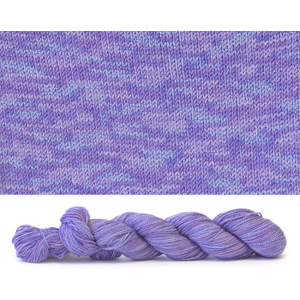 CoBaSi fingering in the color Red Hat Tonal 933, a purple colorway with tonal color variation.