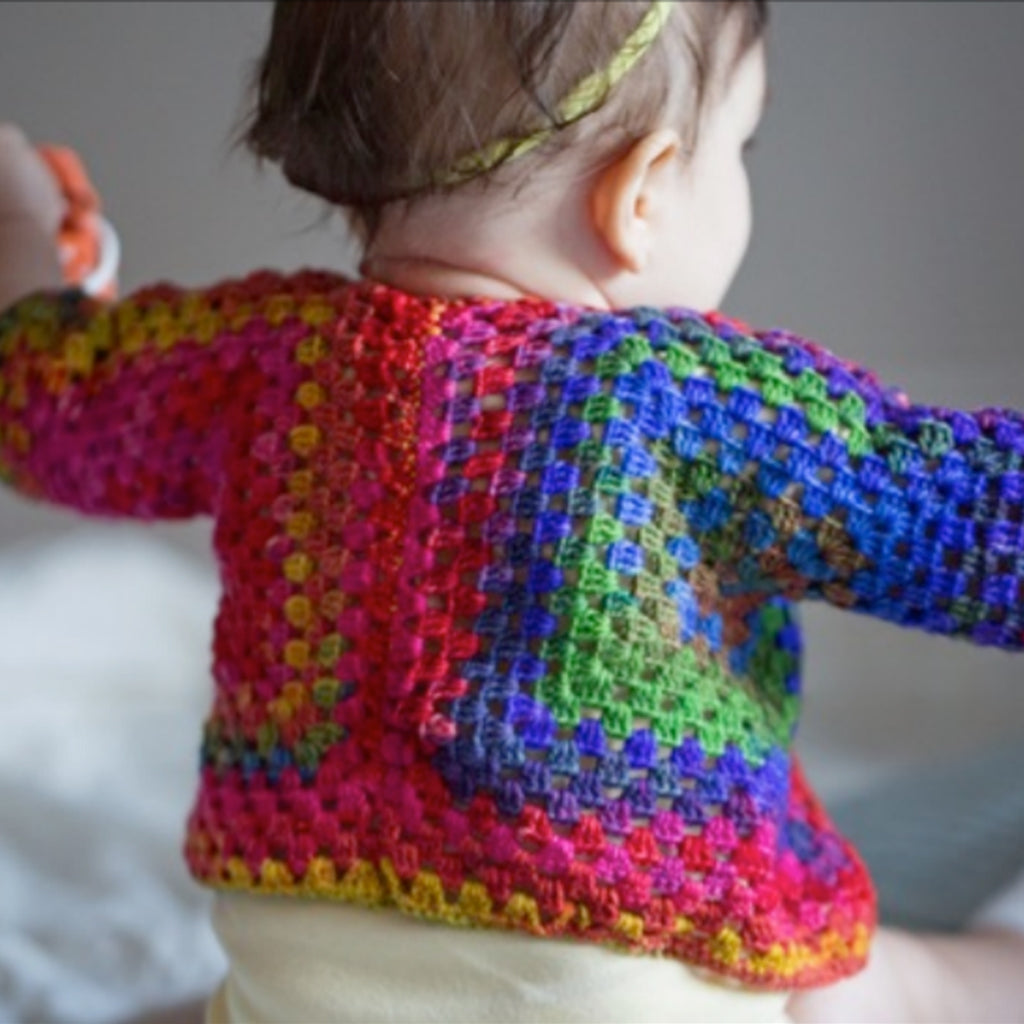 The back of a hand crocheted Squared Up Baby Jacket.
