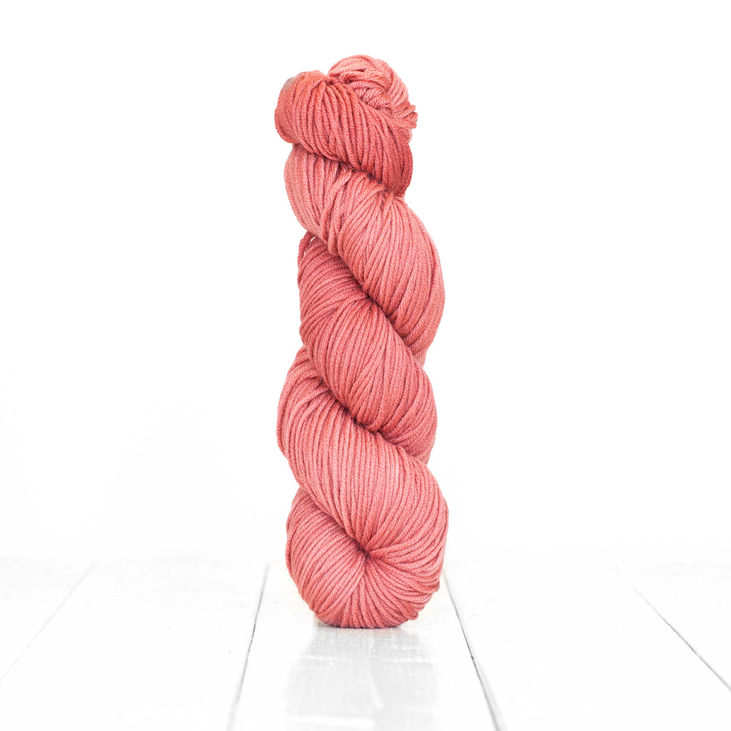 Color Cranberry, a hand-dyed skein of yarn, a pink color produced from natural cranberries.