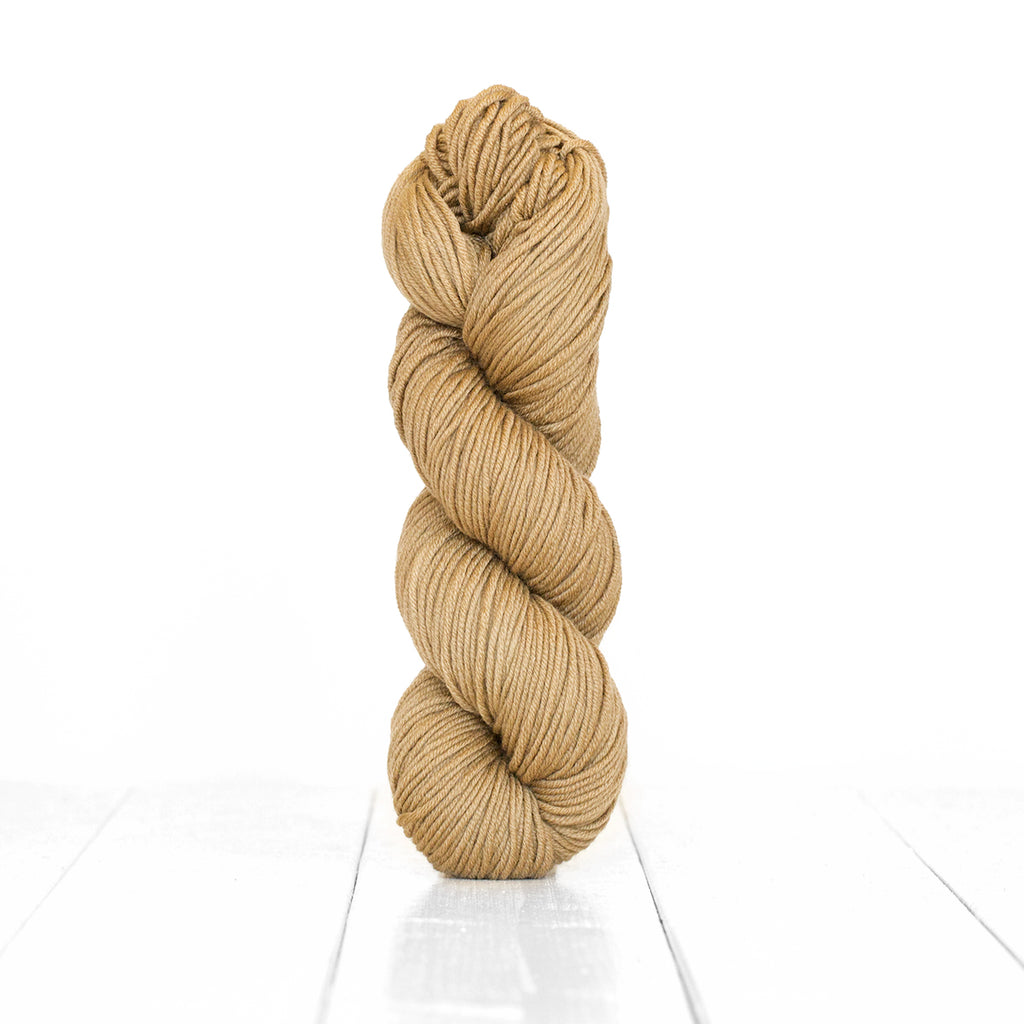 Color Hazelnut, hand-dyed skein of yarn, light tan color produced from natural hazelnuts.