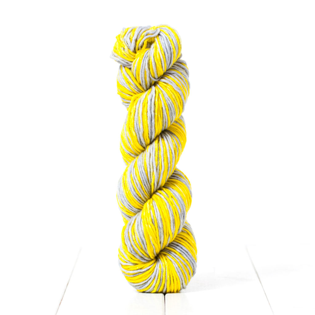PAN21, a limited edition self striping yellow and grey Worsted weight yarn inspired by Pantone's 2021 colors of the year.