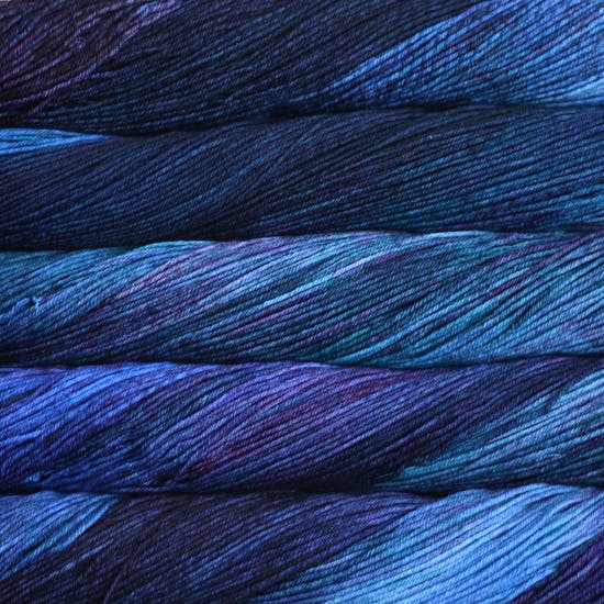 Malabrigo Arroyo Yarn Whales Road 247 - a variegated blue, light blue and purple colorway