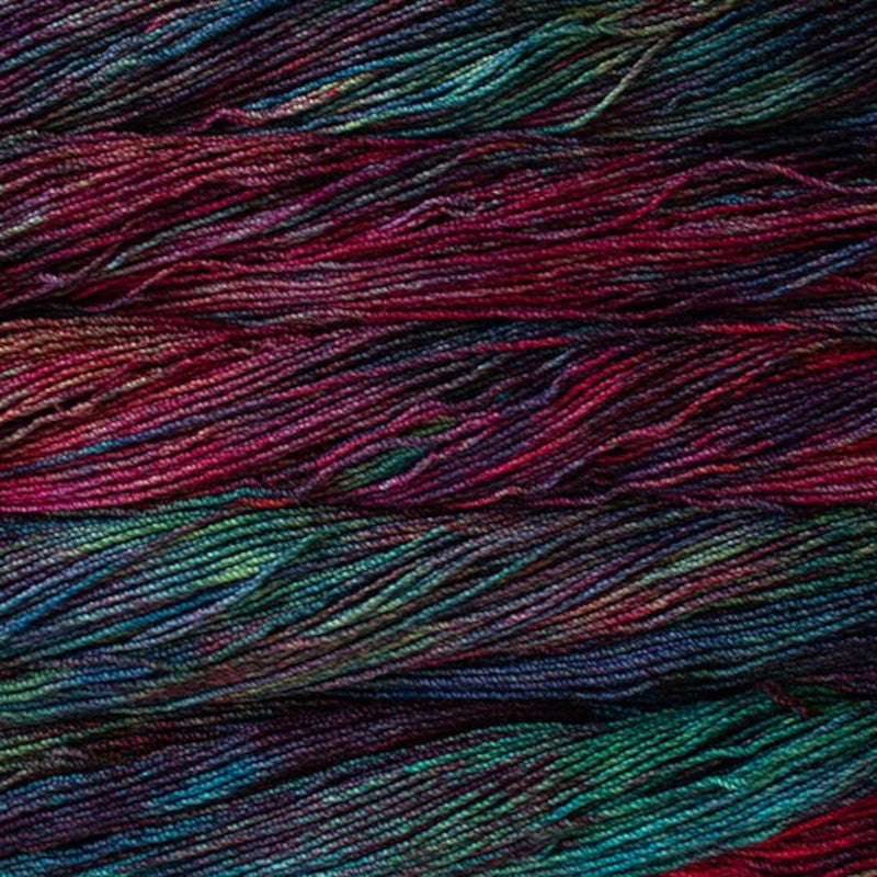 Malabrigo Dos Tierras DK Yarn in Camaleon - a variegated red, blue and green colorway