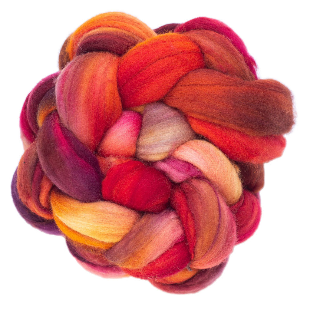 Color 658 Zinnia - a hand dyed merino top in shades of yellow, purple and bright orange.