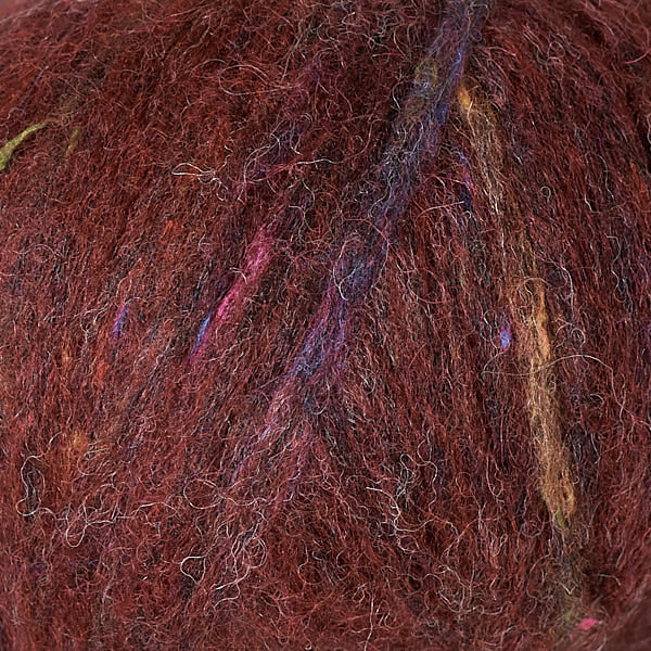 Garnet 3247, a speckled rich red ball of Berroco's Mochi yarn.