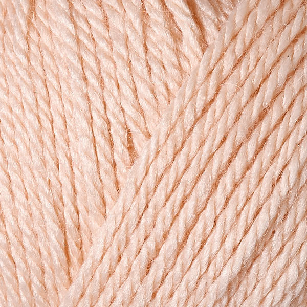 Berroco's Vintage Baby DK yarn in the color Peach 10009, a light peachy pink.