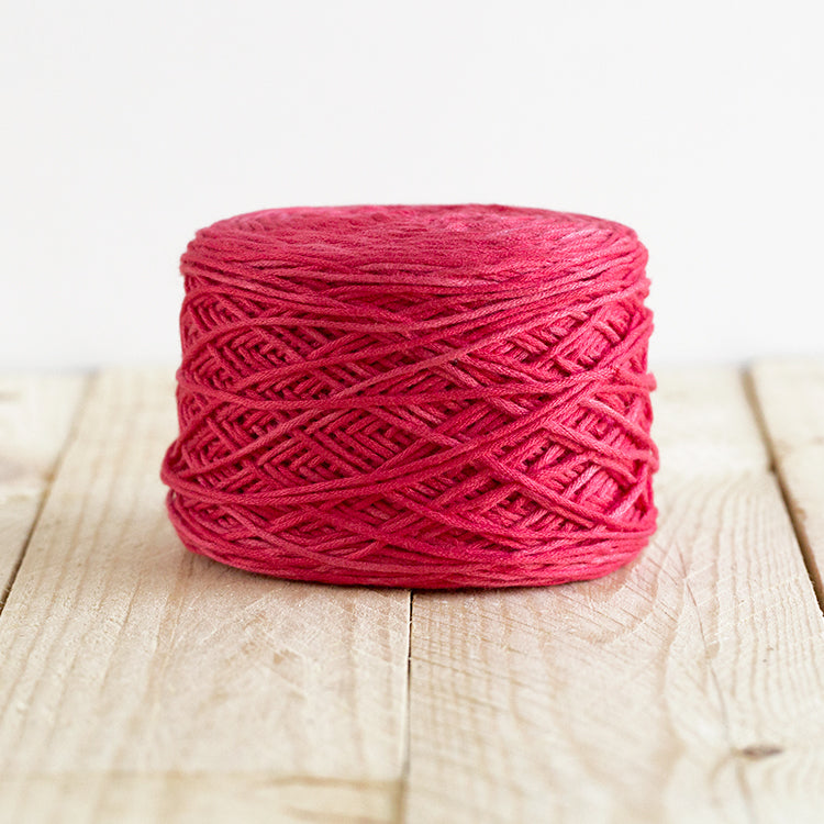 Color 5000, a bright red cake of yarn.