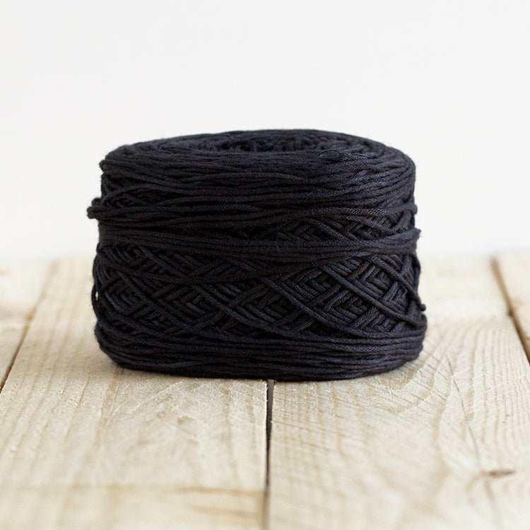Color 5014, a black cake of yarn.