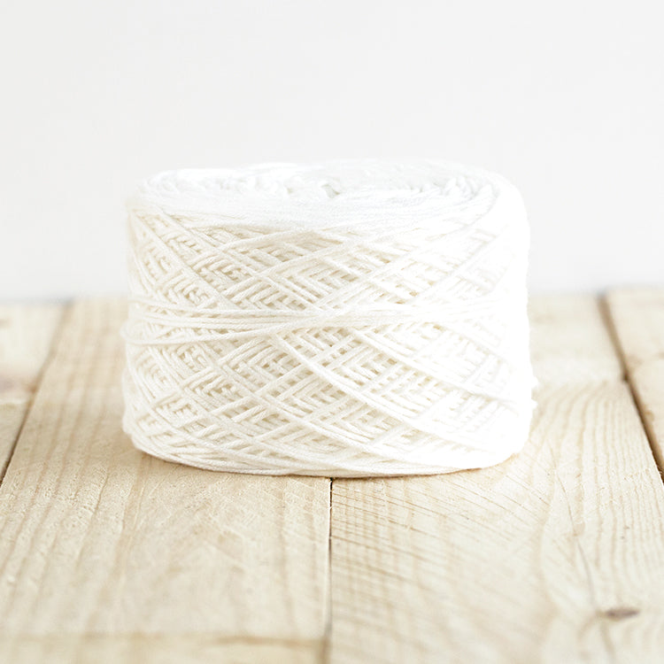Color 5021, a white cake of yarn.