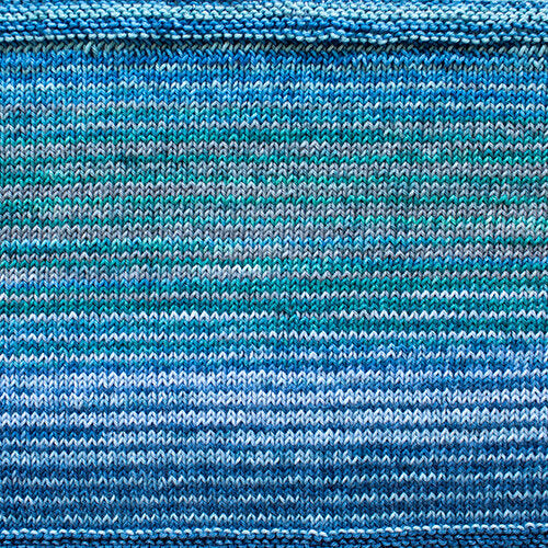 A swatch of Uneek Cotton in the colorway 1072, stripes in shades of blue.