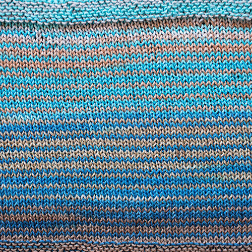 A swatch of Uneek Cotton in the colorway 1087, stripes in shades of blues and greys.