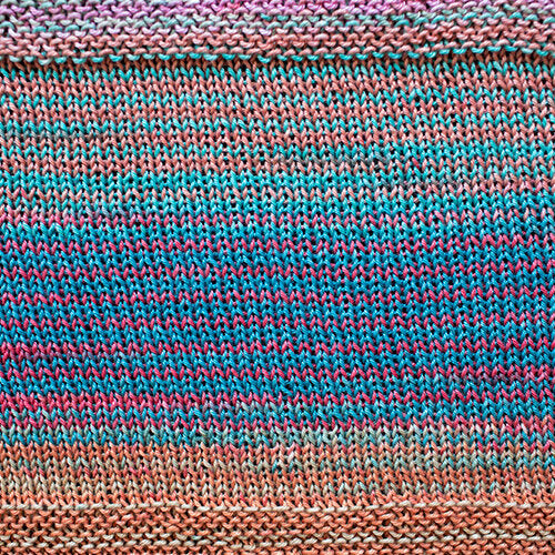 A swatch of Uneek Cotton in the colorway 1088, stripes in shades of blue, orange, pink, and grey.