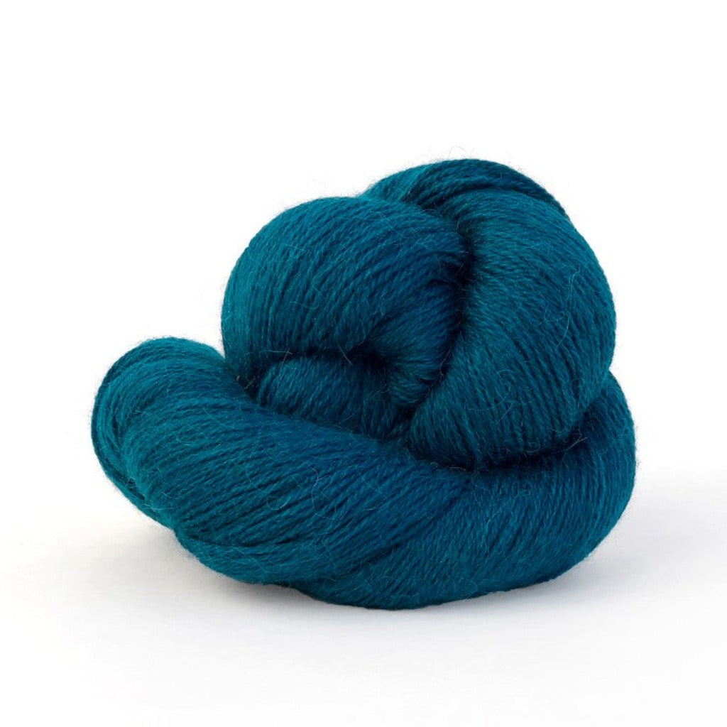 Dark Teal 433: A twisted hank of Kelbourne Woolens Perennial Fingering yarn in a dark teal color