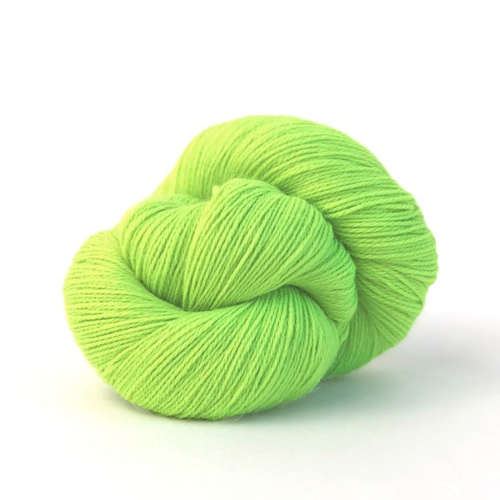 Neon Lime 329: A twisted hank of Kelbourne Woolens Perennial Fingering yarn in a neon green color