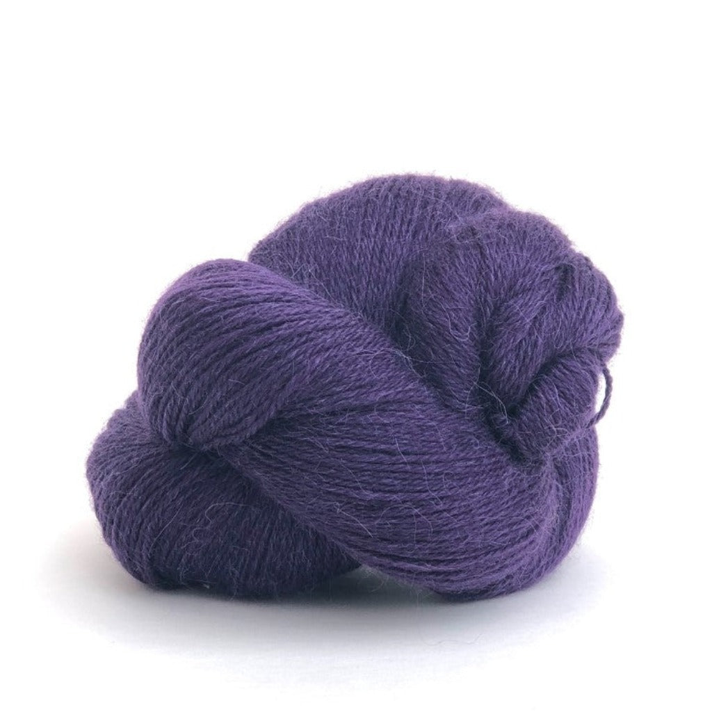 Purple 501: A twisted hank of Kelbourne Woolens Perennial Fingering yarn in a medium purple color