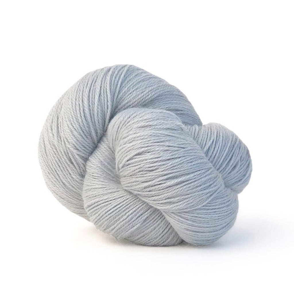 Silver 059: A twisted hank of Kelbourne Woolens Perennial Fingering yarn in a silver grey color