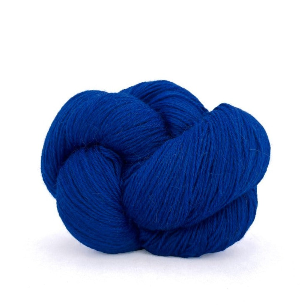 Ultramarine 427: A twisted hank of Kelbourne Woolens Perennial Fingering yarn in a royal blue color