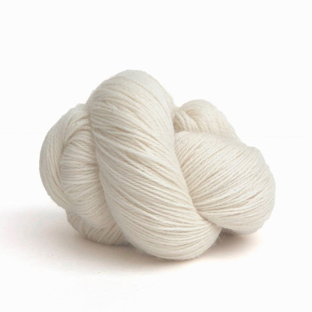 Natural 105: A twisted hank of Kelbourne Woolens Perennial Fingering yarn in a natural white color