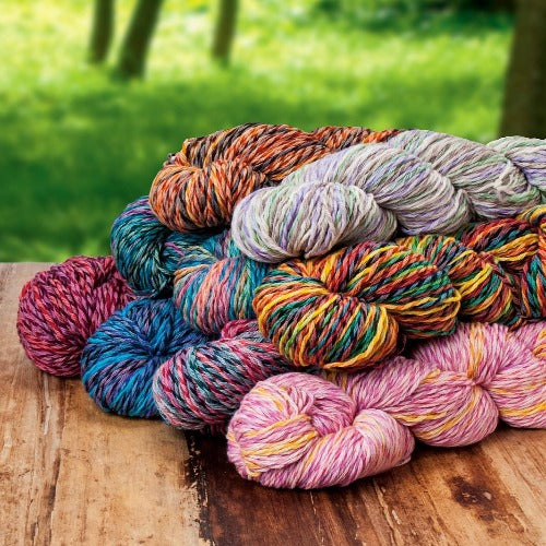A colorful pile of Brown Sheep Synchrony Yarn