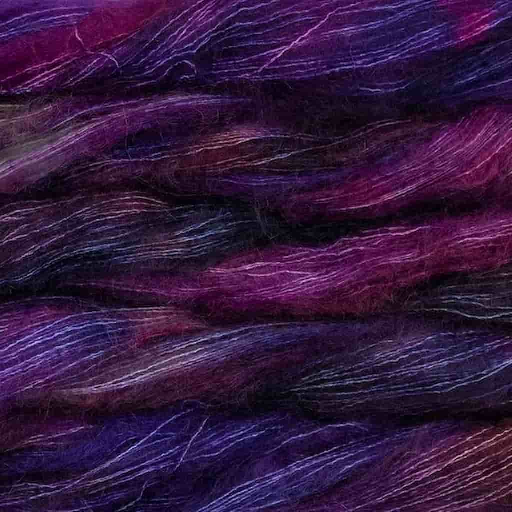 Color: Talisman 249. A dark purple and magenta variegated color of Malabrigo Mohair yarn. 