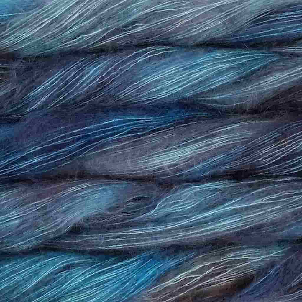 Color: Under the Sea 362. A dark aqua and grey color of Malabrigo Mohair yarn.