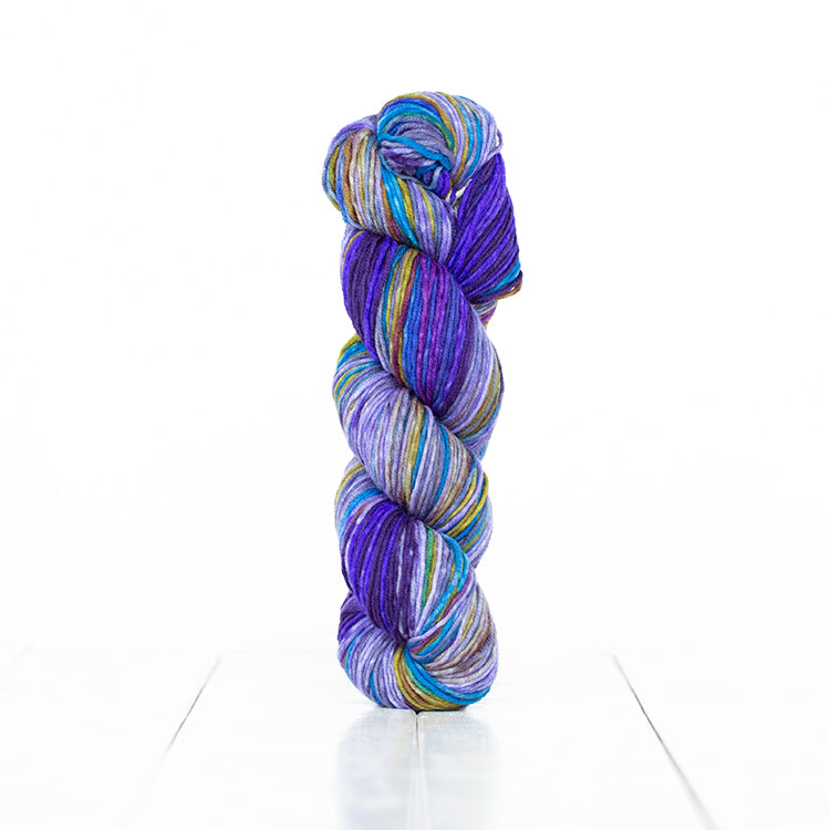 Color 6003,  hand-dyed yarn in self-striping shades of vibrant purples, with some blues and greens.