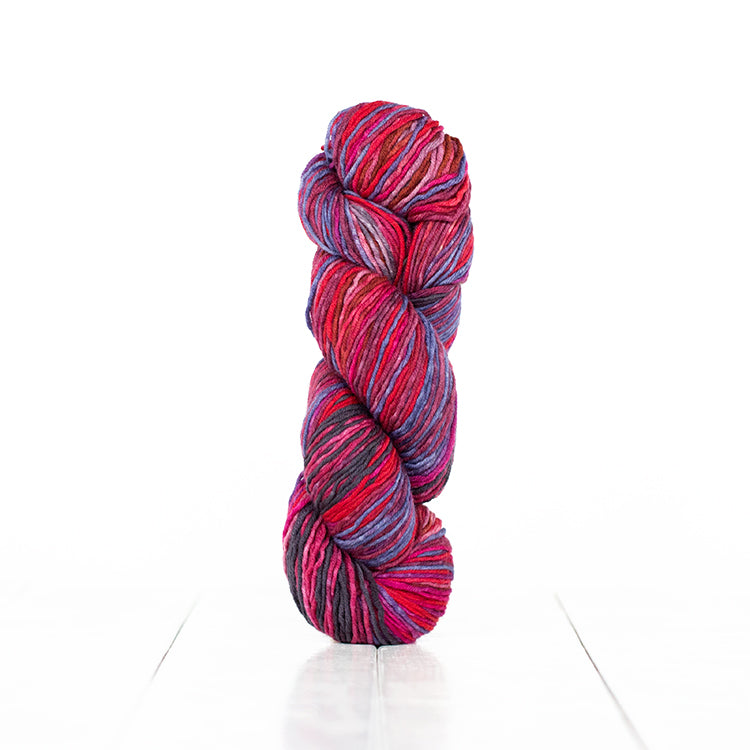 Color 6005, hand-dyed yarn in self-striping reds & pinks, with a little lavender & dark grey.