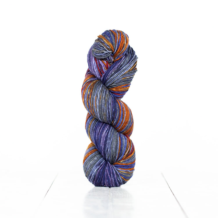 Color 6017, hand-dyed yarn in self-striping shades of saturated greys, purples, and rusty orange.