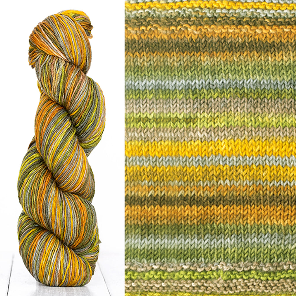 Color 3001: a hand-dyed skein of self striping wool yarn with orange, grey, white, and yellow shades