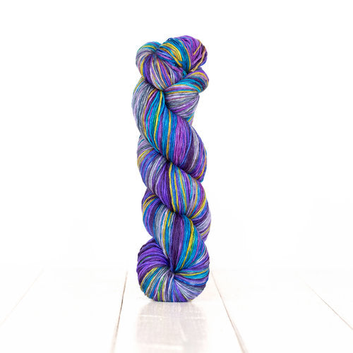 Color 3003: a hand-dyed self-striping wool yarn with blue, purple, and yellow stripes