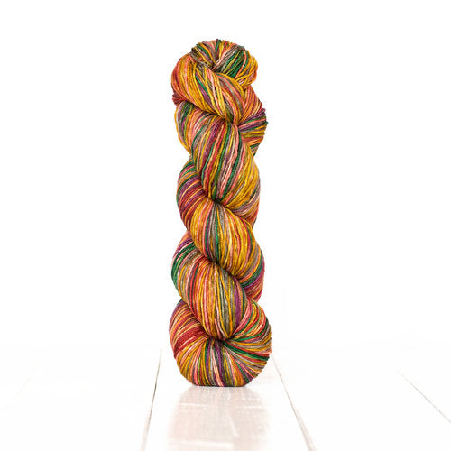 Color 3008: a hand-dyed self-striping wool yarn with brown, pink, orange, green, and purple stripes.