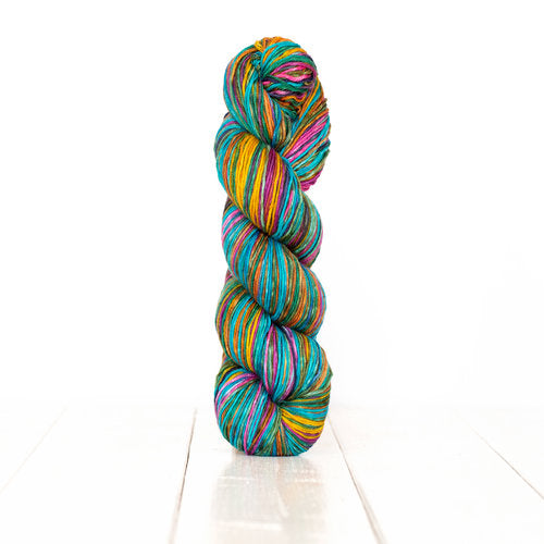 Color 3010: a hand-dyed self-striping wool yarn with purple, yellow, pink, cyan, and green stripes.