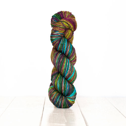 Color 3012: a hand-dyed self-striping wool yarn with blue, purple, green, and yellow shades